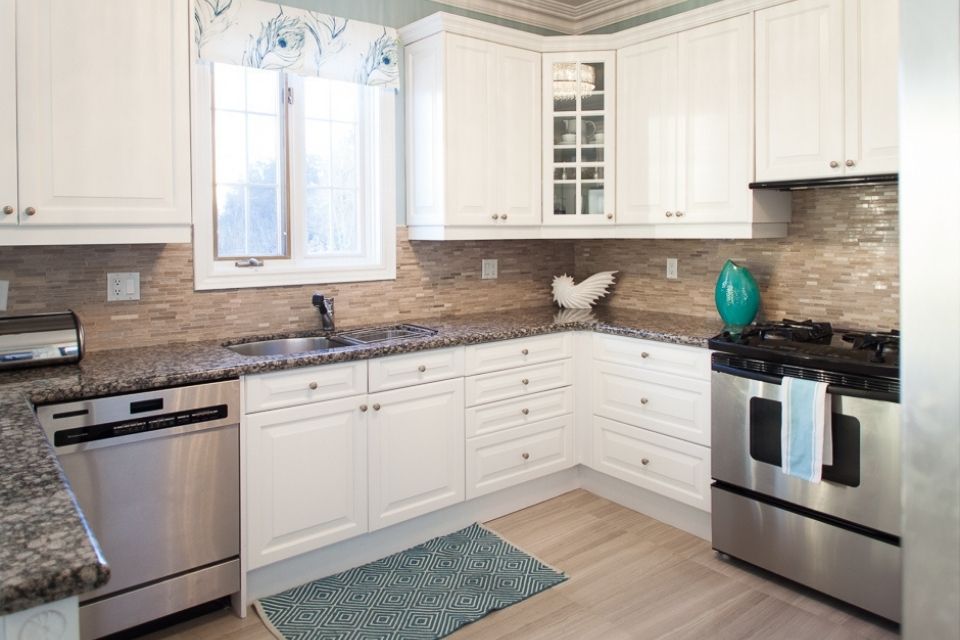 Kitchen design with small area rug in front of sink 